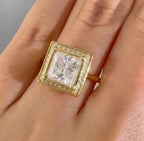 Top view on hand showing a 3 carat princess cut lab grown diamond ring in yellow gold