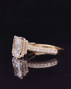 Side profile view of a 3 CT elongated radiant cut lab diamond ring showing hidden halo and multi-row pavé band in yellow gold