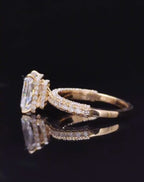 Detailed side profile shot showing hidden halo under-gallery basket on a yellow gold radiant lab diamond ring