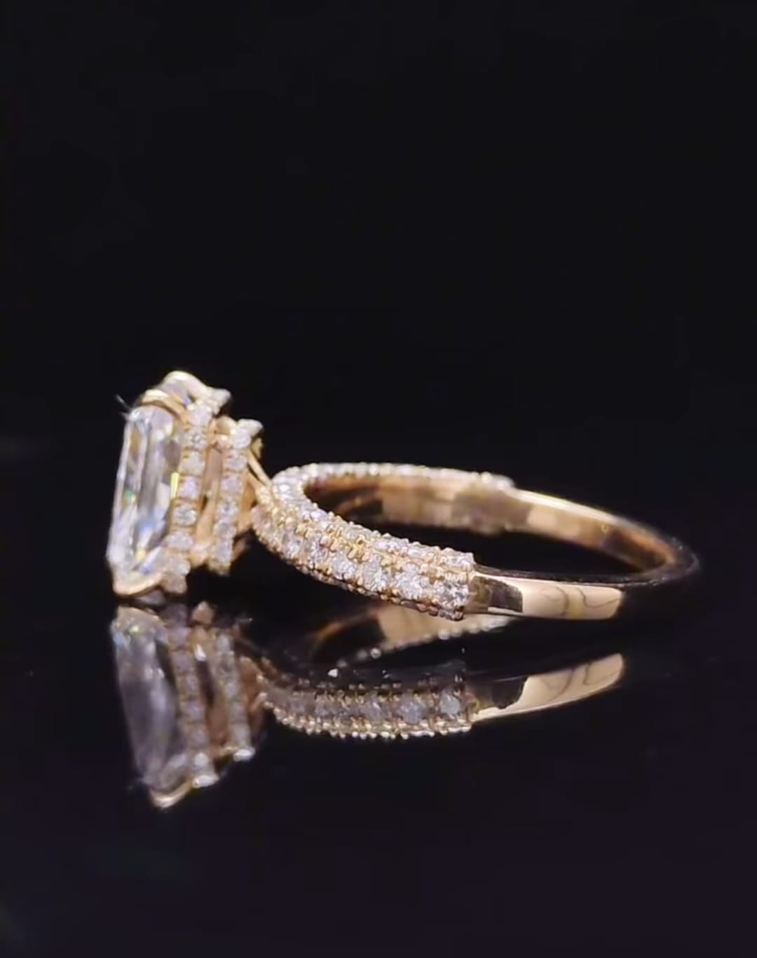 Detailed side profile shot showing hidden halo under-gallery basket on a yellow gold radiant lab diamond ring
