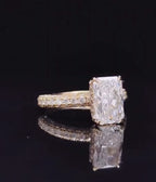 Three-quarter view highlighting the elongated radiant cut lab grown diamond set on a sparkling pavé band