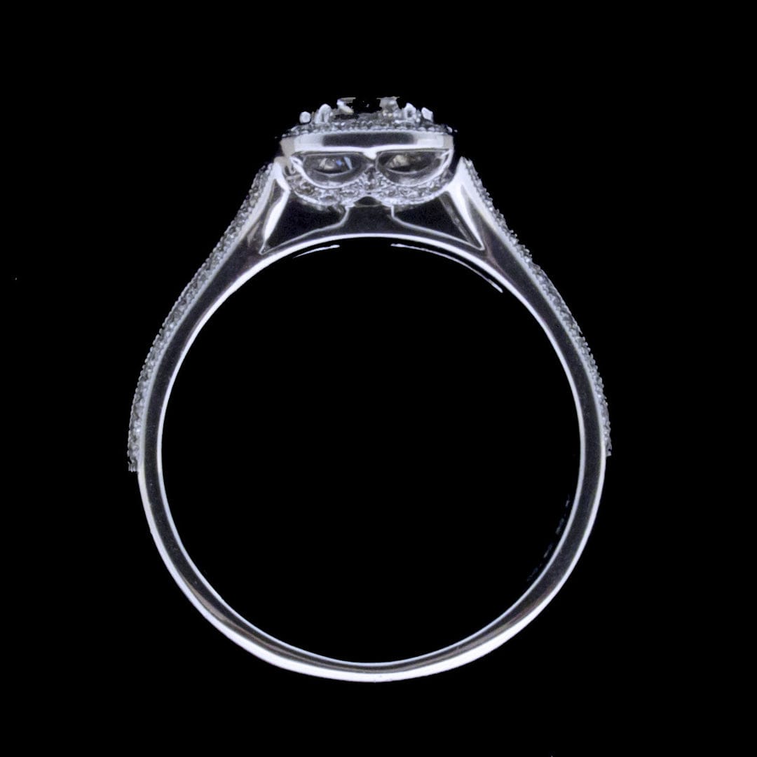 Side profile view showing the halo basket construction and thin band of a 3 carat cushion cut lab diamond ring