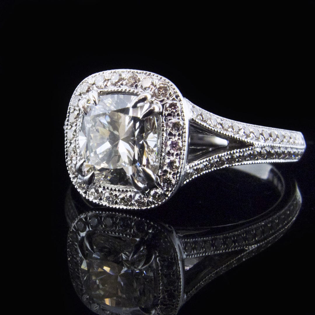 Three-quarter view displaying double corner prongs and detailed milgrain edging on a 3 carat cushion lab diamond halo setting