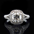 Direct front view showing the brilliance of a 3 CT cushion cut lab grown diamond in a vintage milgrain halo split shank ring