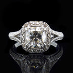 Direct front view showing the brilliance of a 3 CT cushion cut lab grown diamond in a vintage milgrain halo split shank ring