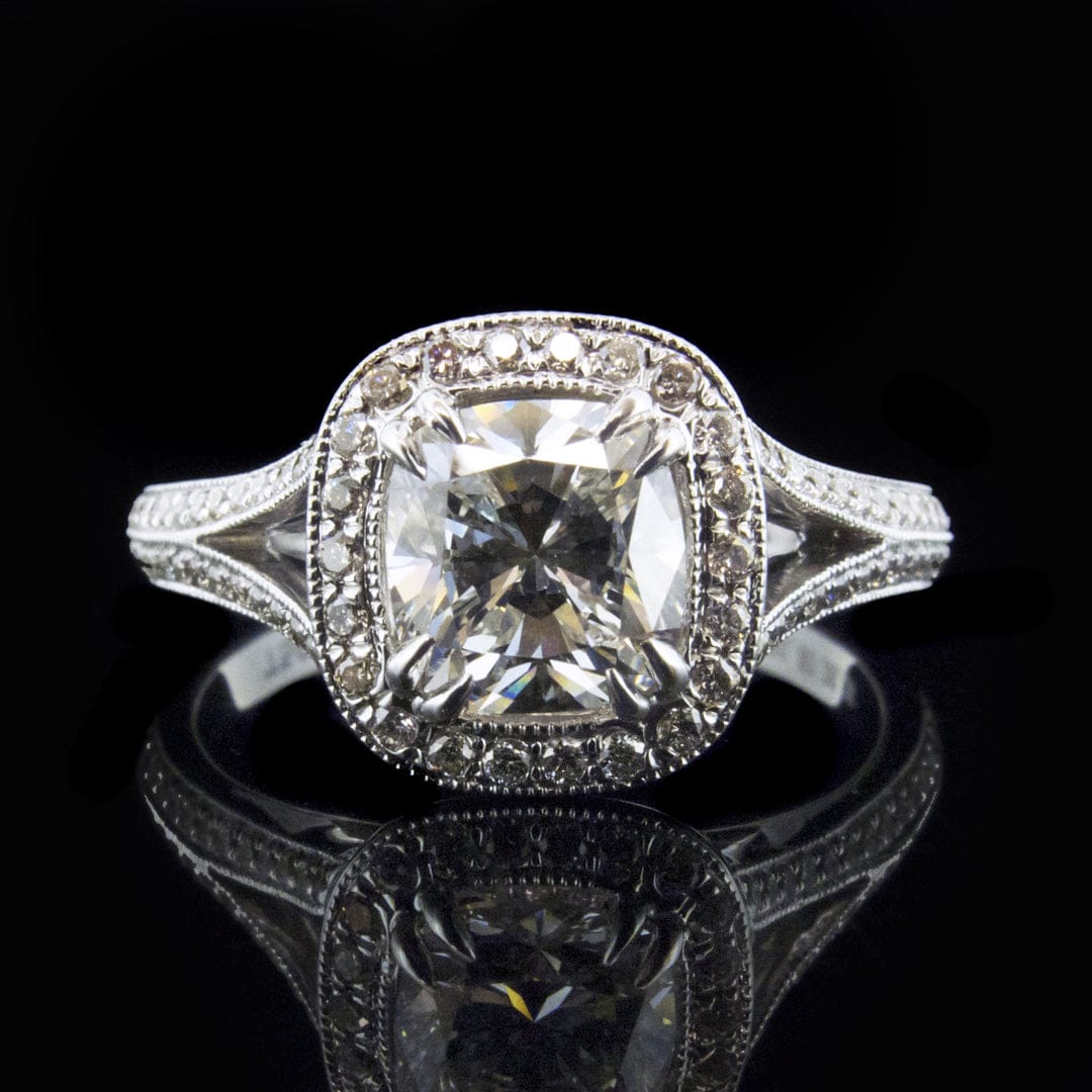 Direct front view showing the brilliance of a 3 CT cushion cut lab grown diamond in a vintage milgrain halo split shank ring