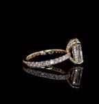 Side profile showing pavé band and hidden halo under-gallery of a 2 CT elongated radiant lab diamond engagement ring in yellow gold