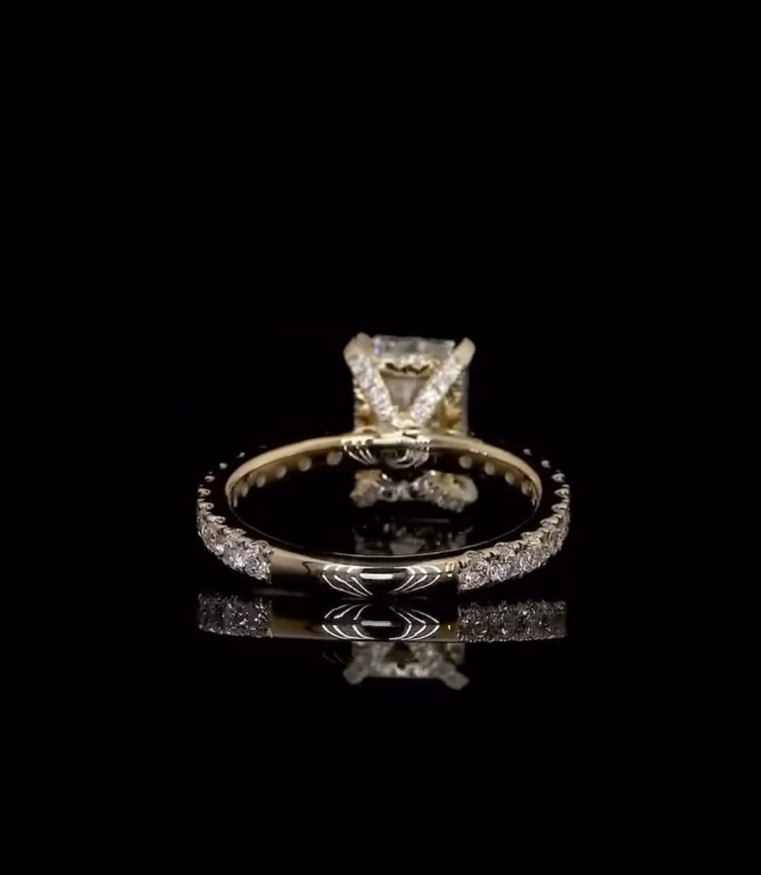 Bottom view showing the polished inside band and diamond-accented shoulders of a 2 carat radiant lab diamond ring
