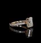 Three-quarter perspective view of a 2 carat elongated radiant cut lab grown diamond engagement ring in 14k yellow gold