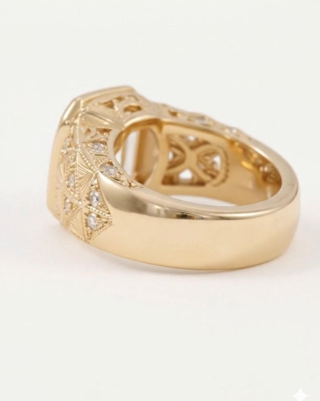 Three-quarter back angle of a yellow gold engagement ring, highlighting the smooth, thick lower band contrasting with the detailed geometric engraving and openwork gallery under the main stone.