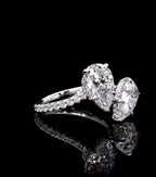 Angled perspective showing the hidden halo under-gallery on twin 1.5 CT pear cut lab grown diamonds