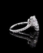 Full side profile shot showing the bypass setting, pavé band, and hidden halo structure in white gold
