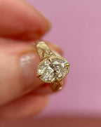 Top-down close-up displaying the facets and sparkle of a 3 CT oval lab diamond in a milgrain frame