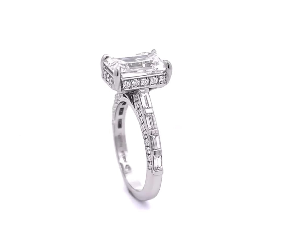 Three-quarter angled view highlighting the hidden halo collar and baguette diamond channel band