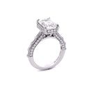 Full side profile highlighting the elevated setting, filigree detailing, and side micro-pavé accents