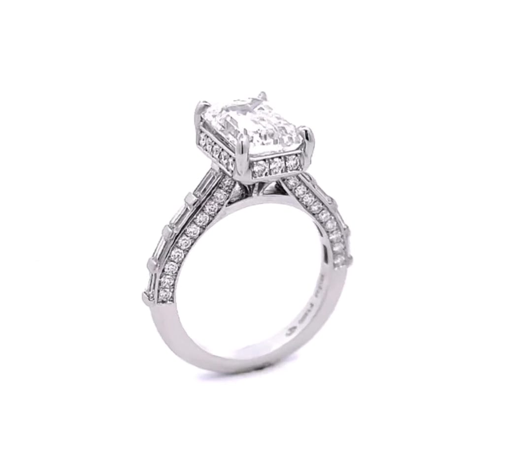 Full side profile highlighting the elevated setting, filigree detailing, and side micro-pavé accents