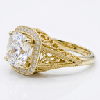 Side perspective view of 18K yellow gold Asscher cut lab diamond vintage halo ring displaying interior gold hallmark stamp.