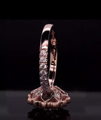 Vertical profile view displaying the pavé-set diamond band and rose gold polish on a 3 CT lab diamond ring