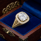 3 CT Asscher cut lab grown diamond vintage filigree ring resting inside a royal blue velvet-lined wooden display box.