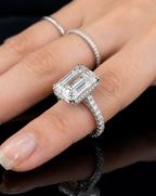 4 Carat Emerald Cut Lab Diamond Engagement Ring with micro-pavé band worn on finger