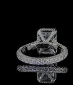 Angle view showing the intricate pavé undergallery and basket struts of a 4 CT emerald lab diamond ring
