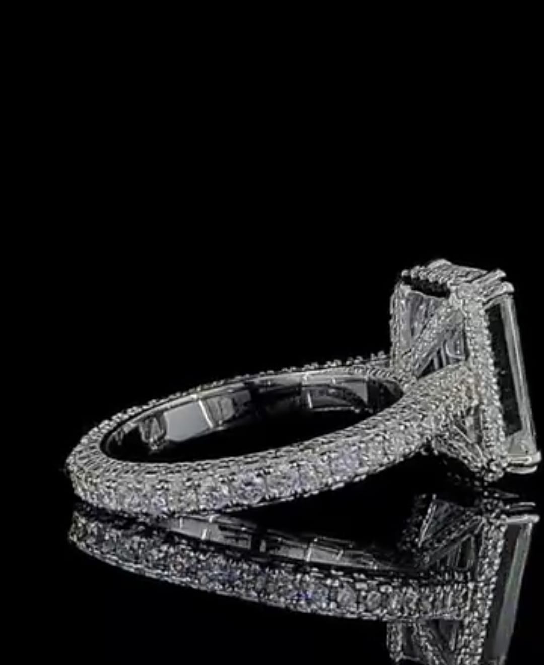 Angled view of 4 CT Emerald Cut Lab Grown Diamond Engagement Ring with pavé band and hidden collar