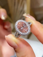 Close-up view of 3 CT Fancy Pink Oval Cut Lab Grown Diamond Ring with double white diamond halo