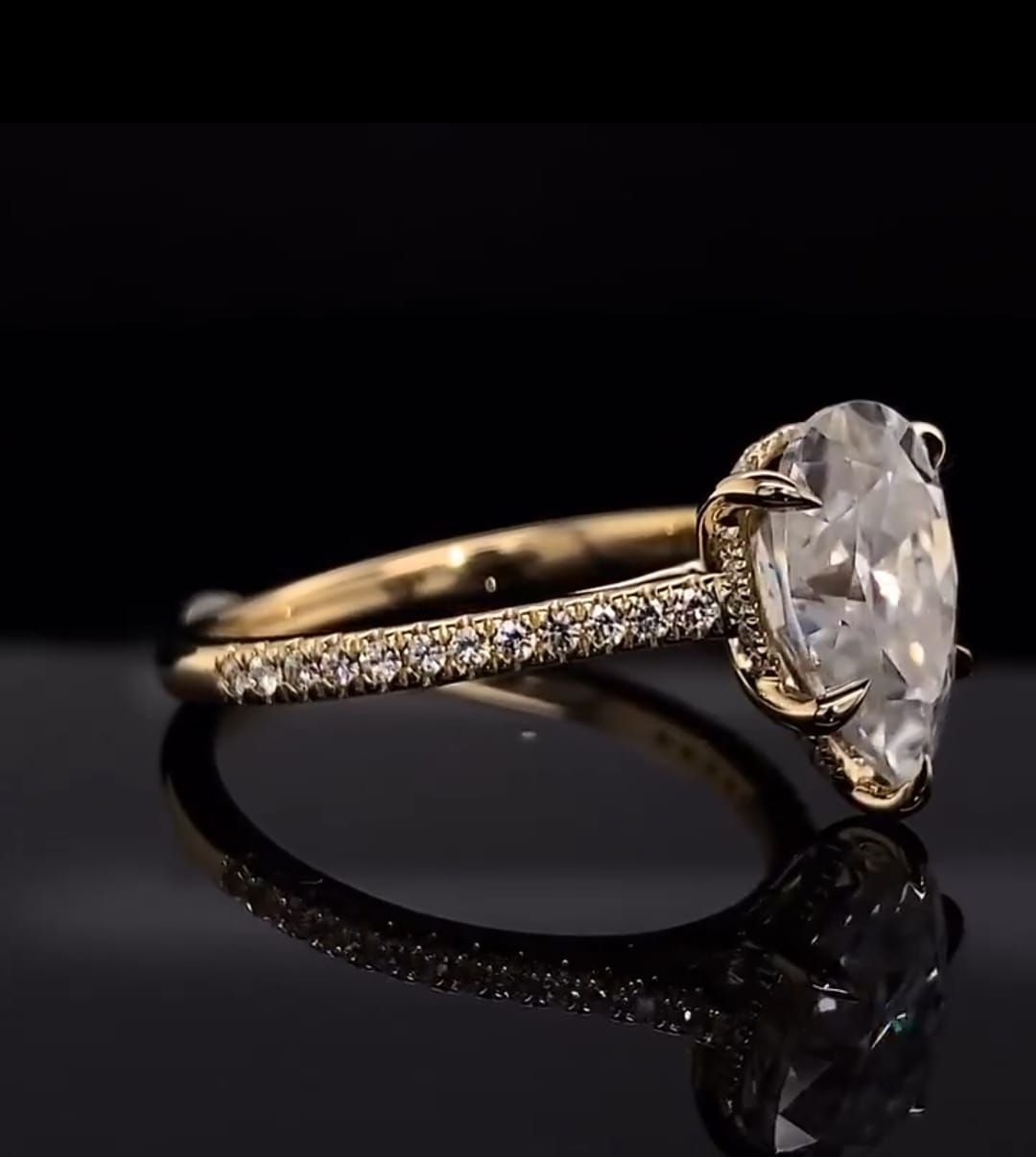 Angled side view of a 3 Carat Pear Shaped Lab Diamond Ring with delicate claw prongs and micro-pavé band