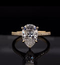 Front top view showing brilliant teardrop shape of a 3 CT Pear Cut Lab Diamond Ring in yellow gold