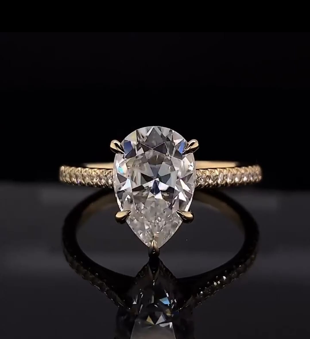 Front top view showing brilliant teardrop shape of a 3 CT Pear Cut Lab Diamond Ring in yellow gold