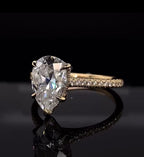 Angled perspective view showcasing the sparkle of a 3 CT Pear Cut Lab Diamond with pavé shank