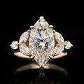 Perspective shot highlighting the fire and brilliance of a 4 CT Marquise Lab Diamond Ring with side stone cluster
