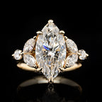 Perspective shot highlighting the fire and brilliance of a 4 CT Marquise Lab Diamond Ring with side stone cluster