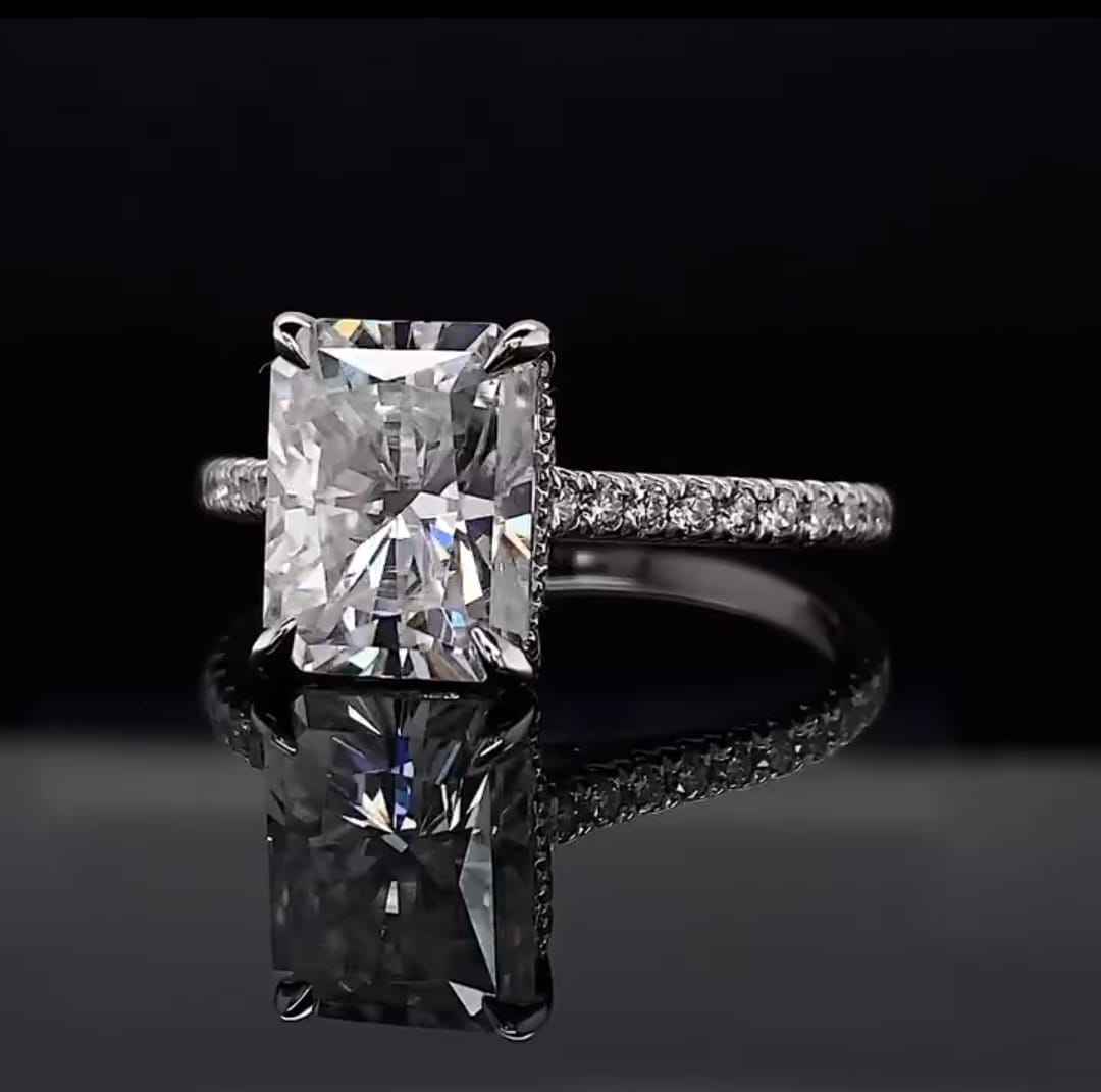 Front-angled view of a 3 CT Radiant Cut Lab Diamond Ring in 14K white gold with pavé band
