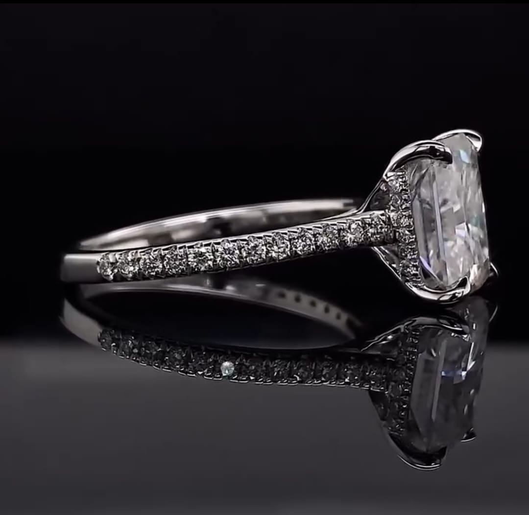 Detailed profile view of the micro-pavé hidden halo basket on a white gold radiant lab diamond ring