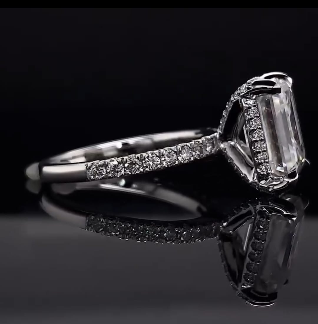 Side profile view showing micro-pavé hidden halo basket and band on a 3 CT Emerald Cut Lab Diamond Ring