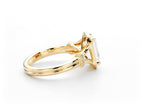High-angle side view of 2 CT emerald cut lab diamond ring set in 14K gold