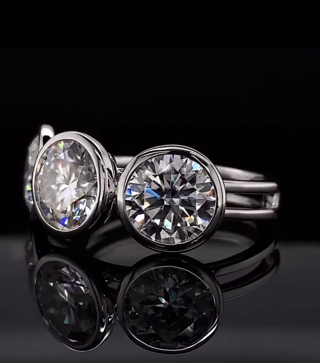Perspective view showcasing the brilliant fire and smooth bezel setting of a three-stone lab diamond ring