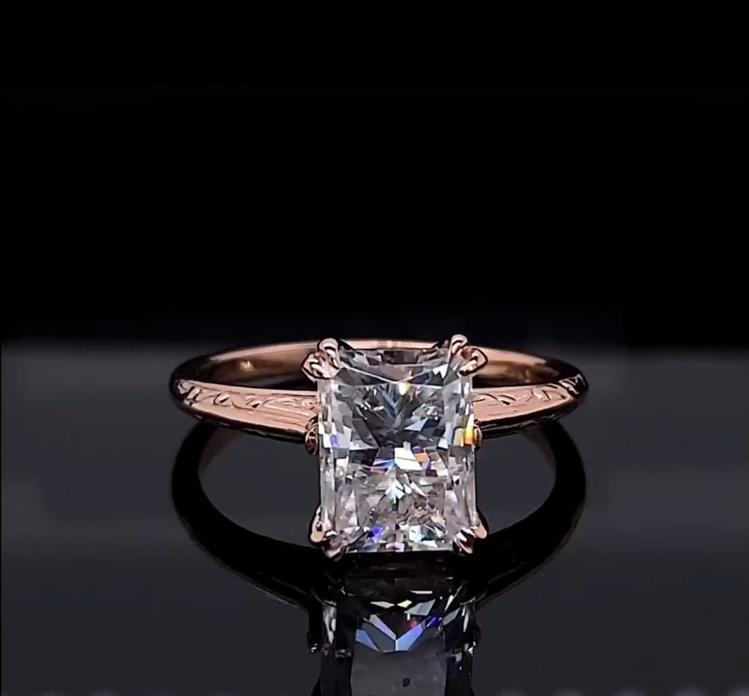 Front view of 3 CT radiant cut lab grown diamond engagement ring in rose gold with engraved band