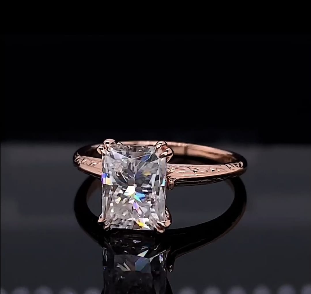 Angle shot showcasing the fire and brilliant facets of a 3 carat radiant cut lab diamond ring
