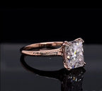Side angle displaying the intricate vintage floral hand-engraved pattern on the rose gold band