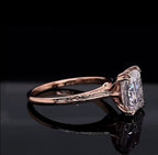 Profile view showcasing the claw prongs, cathedral setting, and engraved shoulder details