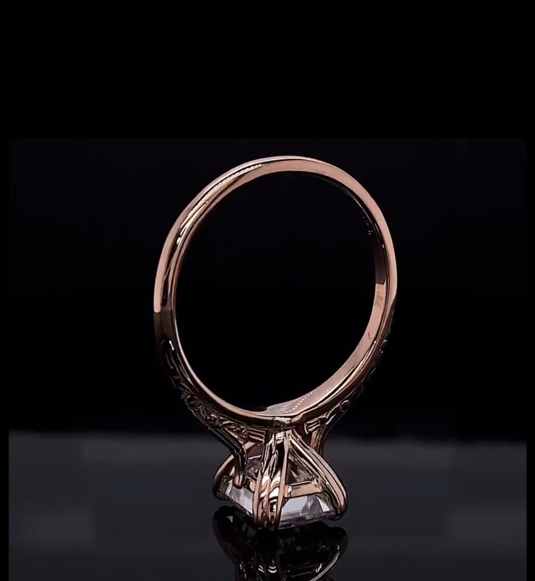 Side perspective highlight of the rose gold basket gallery and 3 carat radiant lab diamond