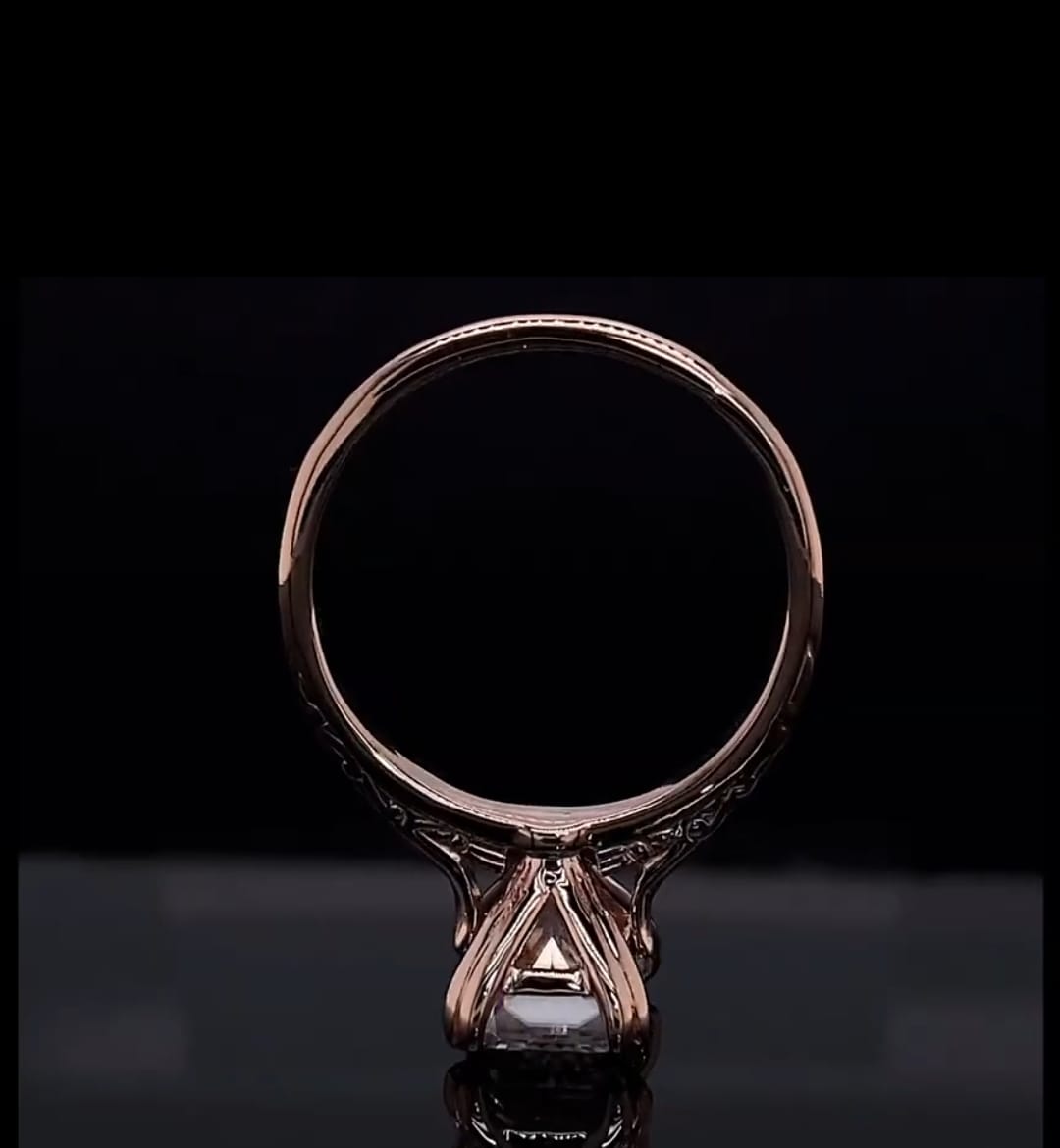 Direct bottom profile shot of the ring standing upright, showing basket architecture and claw prongs