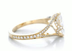 High-angle side view showcasing the pave diamond accents and milgrain edges