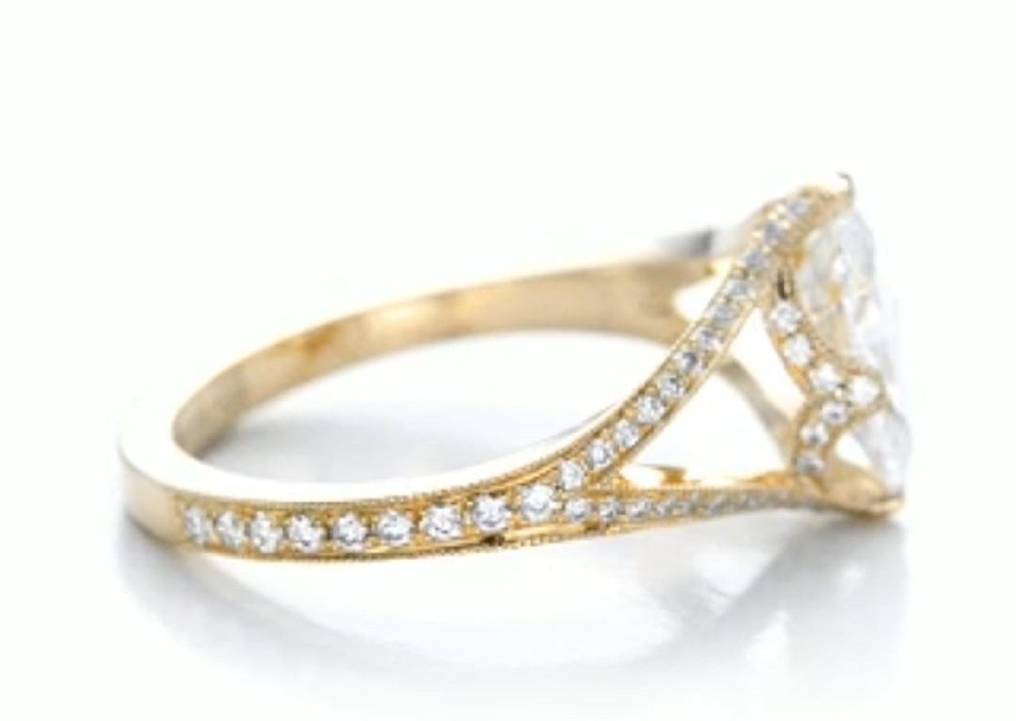 High-angle side view showcasing the pave diamond accents and milgrain edges