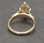 Under-bridge view of 4 CT marquise diamond setting in solid yellow gold.