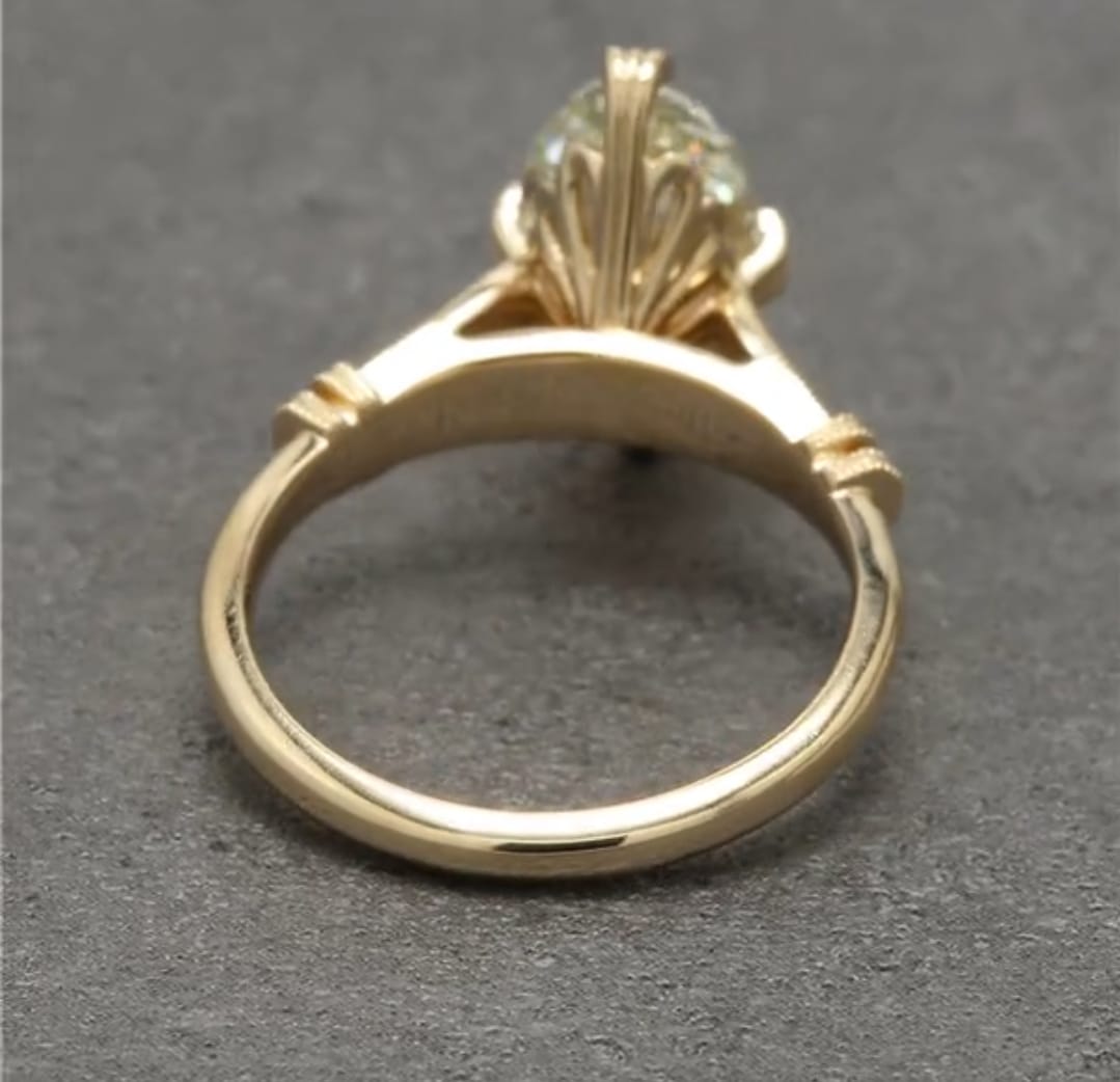 Under-bridge view of 4 CT marquise diamond setting in solid yellow gold.