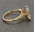 Detailed shot of the milgrain band and clear marquise diamond facet structure.