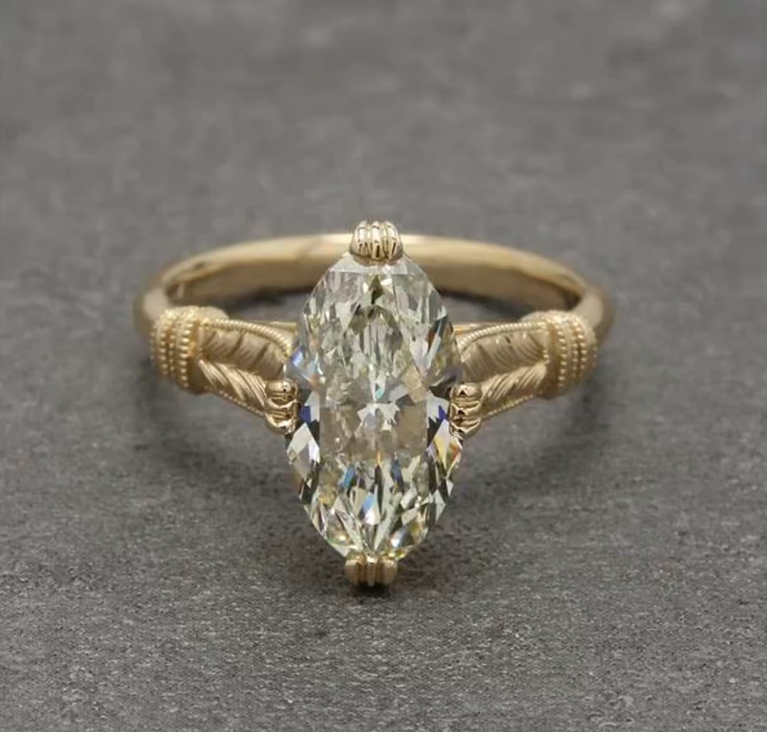 Direct top-down front view of a 4 carat marquise cut lab grown diamond ring.